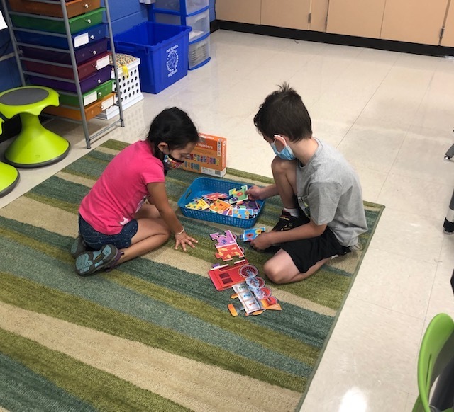 Kids doing puzzle